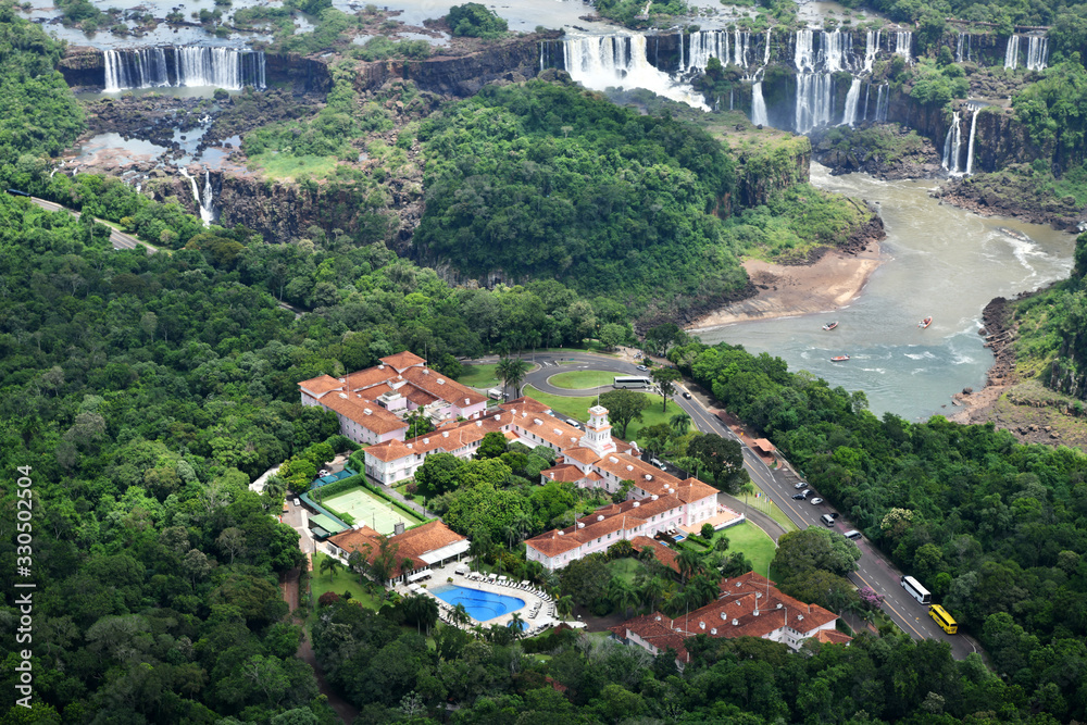 Fototapeta premium large river in the wild jungle and nature park from a helicopter