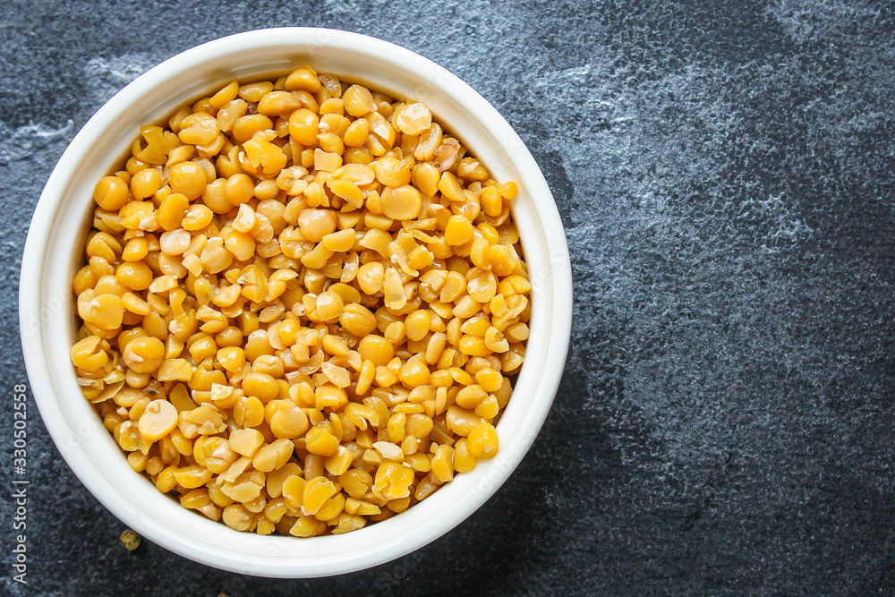 dry yellow peas boiled porridge healthy food (meat product sausage) menu concept background. top view. copy space for text dry yellow peas boiled porridge healthy food (meat product sausage) menu concept background. top view. copy space for text