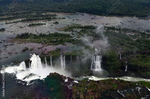 wild roaring waterfall with cascades in the jungle view from a helicopter