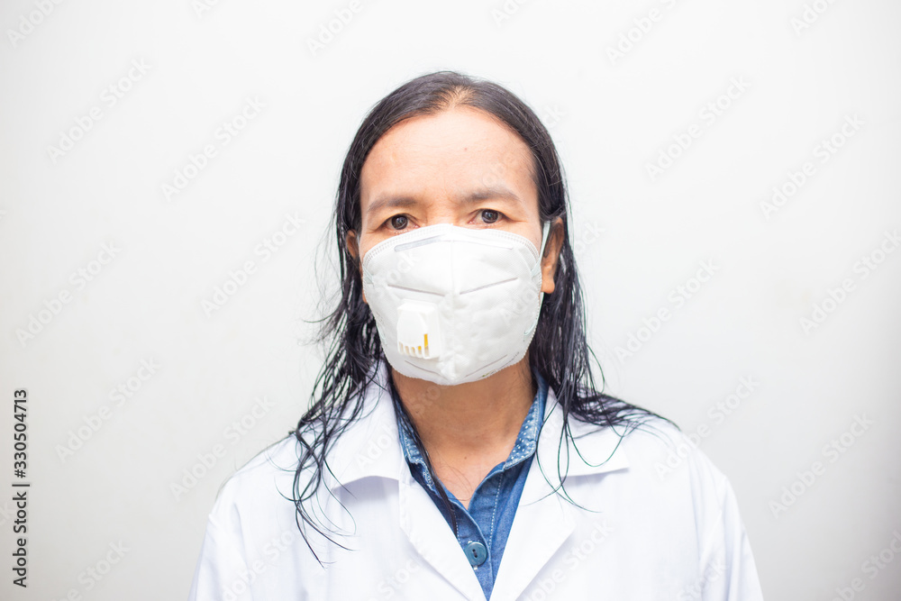 Elderly asian women wearing KN95 masks covering their mouths and noses preventing coronavirus and pm 2.5 dust on white background. Elderly asian women wearing KN95 masks covering their mouths and noses preventing coronavirus and pm 2.5 dust on white background.