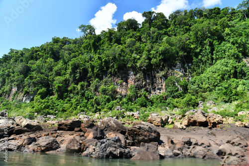 a trip to the roaring waterfalls on the river in a motor boat in a national park in brazil