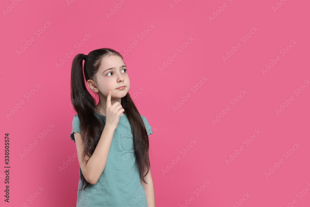 Pensive little girl on pink background, space for text. Thinking about answer to question Pensive little girl on pink background, space for text. Thinking about answer to question