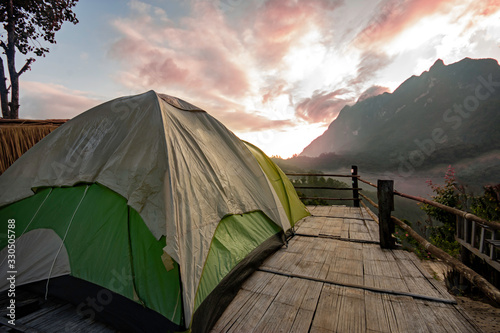 ฺBeautiful morning in the mountains and orange tent at district,Chiang Mai province thailand photo