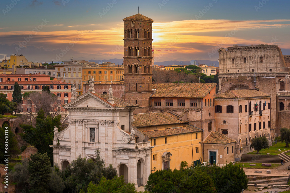 Architecture of the old town in Rome at sunset, Italy