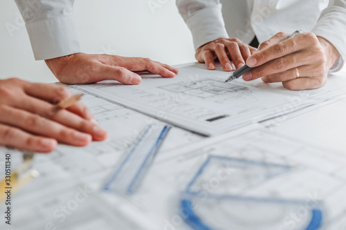 Team Engineer drawing graphic planning and meeting for architectural project on workplace