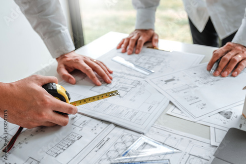 Team Engineer drawing graphic planning and meeting for architectural project on workplace