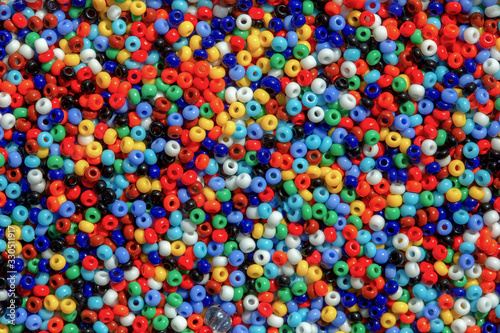 Macro photography of some colorful beads of different shape used for manufacturing jewerly and accesories.