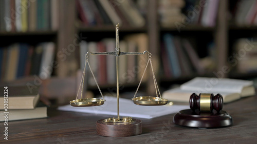 Close up Shoot of Gavel and Gold Brass Balance Scale on Judge Table