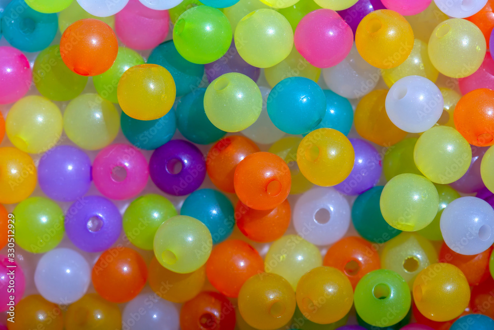 Macro photography of some colorful beads of different shape used for manufacturing jewerly and accesories. Macro photography of some colorful beads of different shape used for manufacturing jewerly and accesories.
