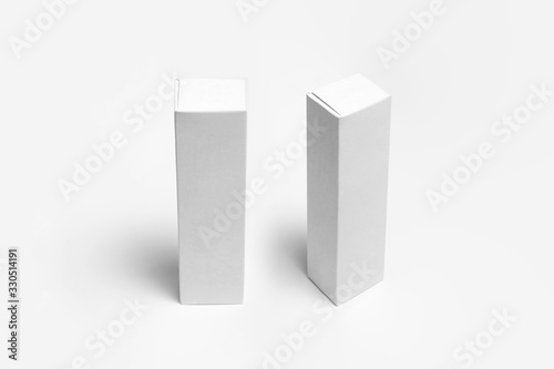 Blank packaging white Cardboard Paper Boxes  Mock up on white.Toothpaste package.High resolution photo. © sabir