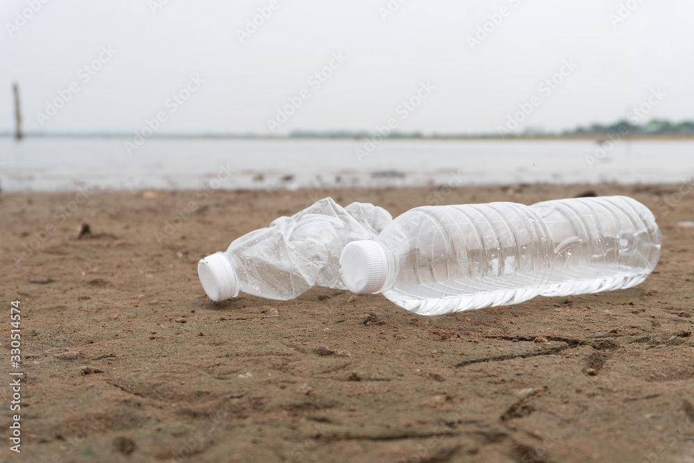 Plastic water bottles pollution in the ocean (Environment concept)