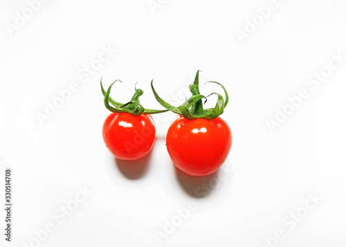 Vegetable series - One small vine cherry tomatoes isolated on white background