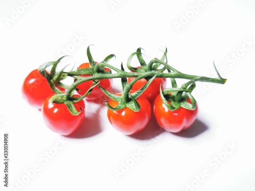 Vegetable series - Bunch of cherry tomatoes isolated on white background.