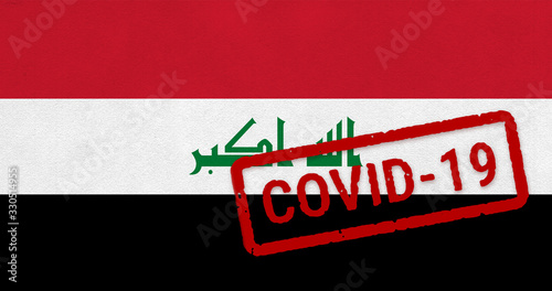 Flag of Iraq on paper texture with stamp, banner of Coronavirus name on it. 2019 - 2020 Novel Coronavirus (2019-nCoV) concept, for an outbreak occurs in the Iraq.