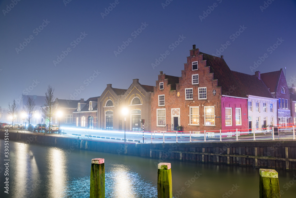 Harlingen, Netherlands - January 09, 2020. Traditional dutch houses at night