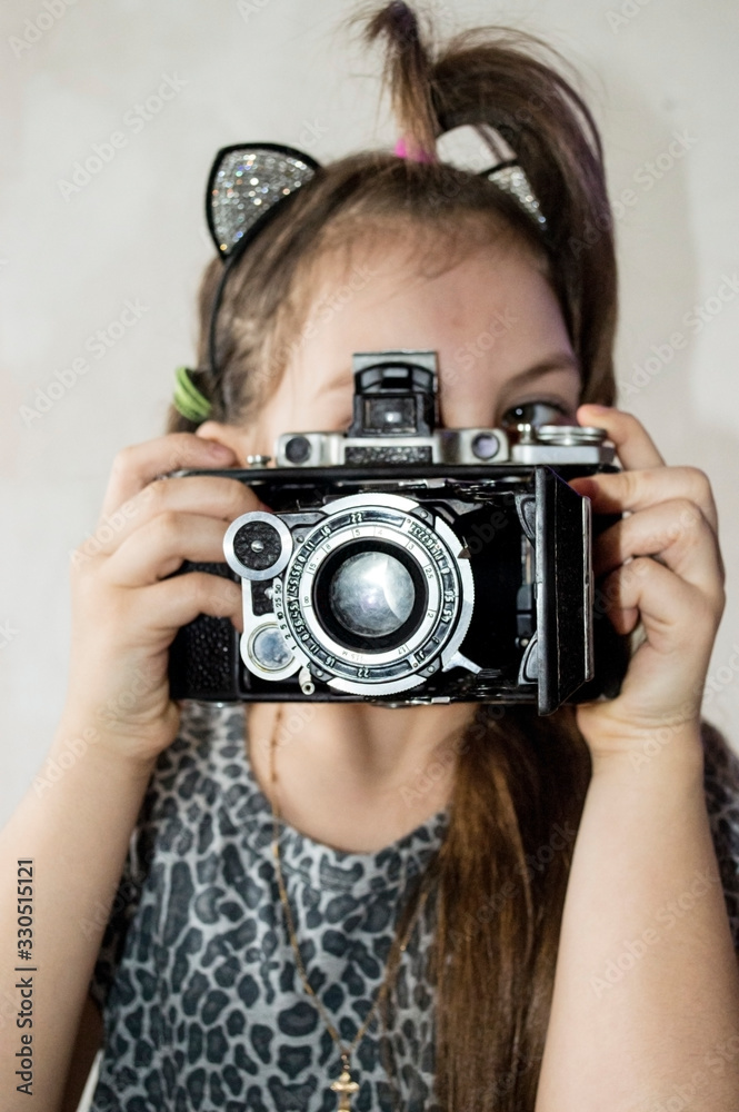 girl taking pictures with an old camera girl taking pictures with an old camera