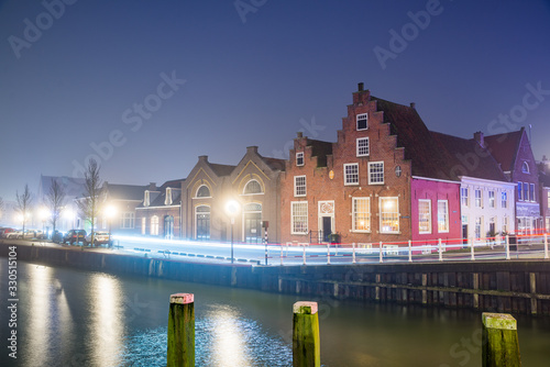 Harlingen, Netherlands - January 09, 2020. Traditional dutch houses at night