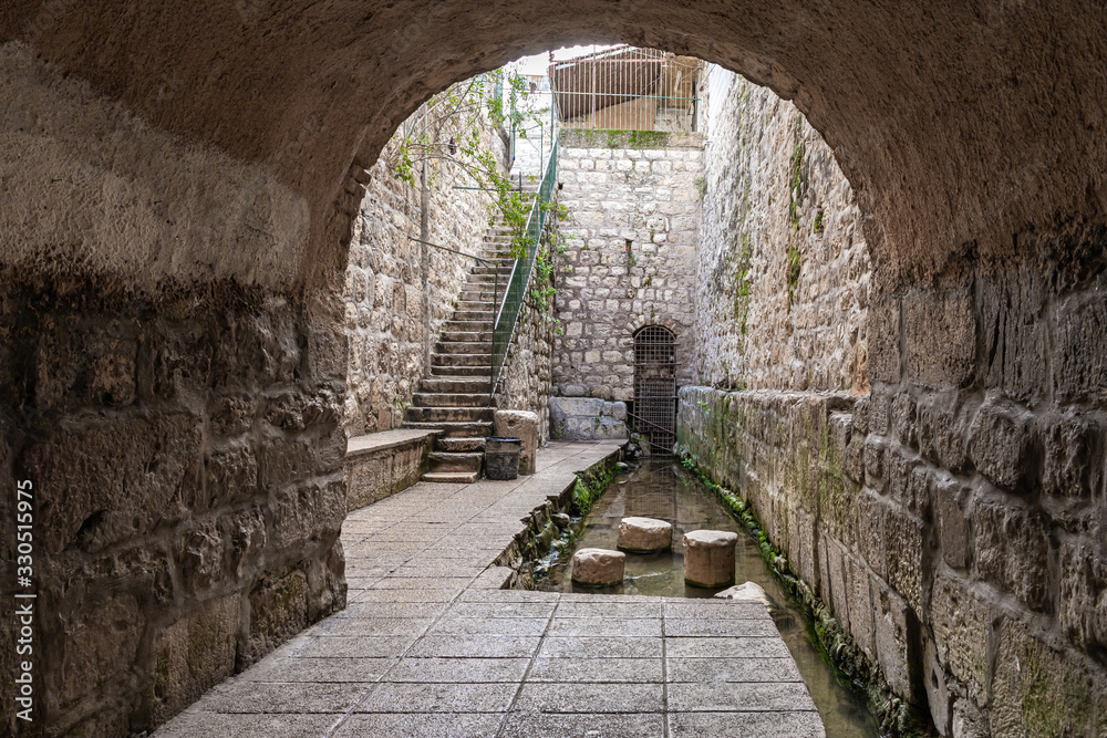 Naklejka premium The Pool of Siloam in Silwan, the Arab suburb of Jerusalem in Israel