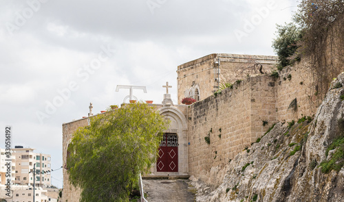 The entrance to the Greek Akeldama Monastery in the old city of Jerusalem in Israel photo