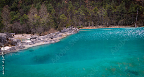 beautiful blue color lake inside the forest 