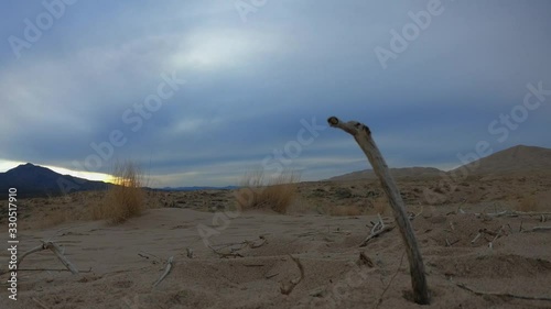 Beautiful time lapse of brown dunes and clouds in the Mojave desert of California, USA. Beauty landscape with desert and cloudy sky at Mojave. Scenic desertic at cloudy day of winter.