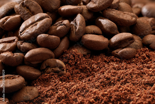 macro of roasted coffee beans and ground coffee