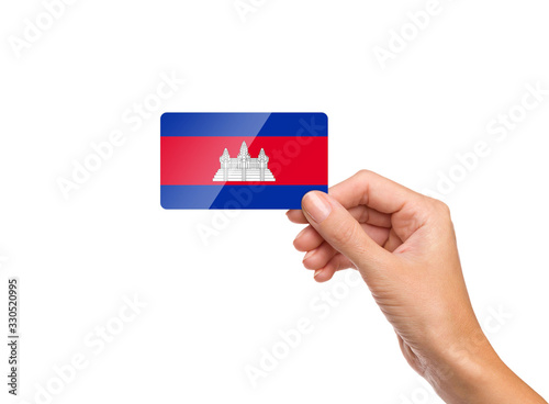 Beautiful hand holding Cambodia flag card on white background