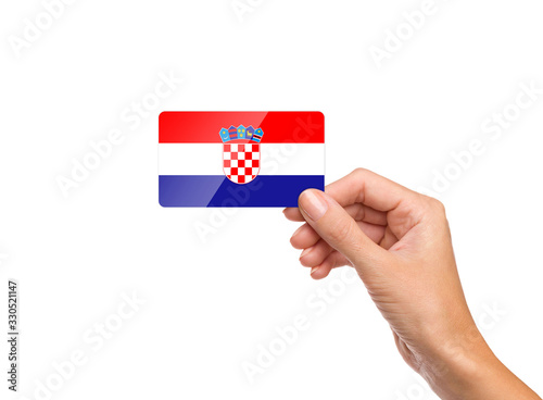 Beautiful hand holding Croatia flag card on white background