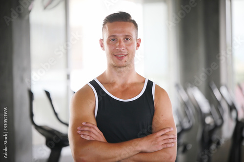young man doing exercises in gym