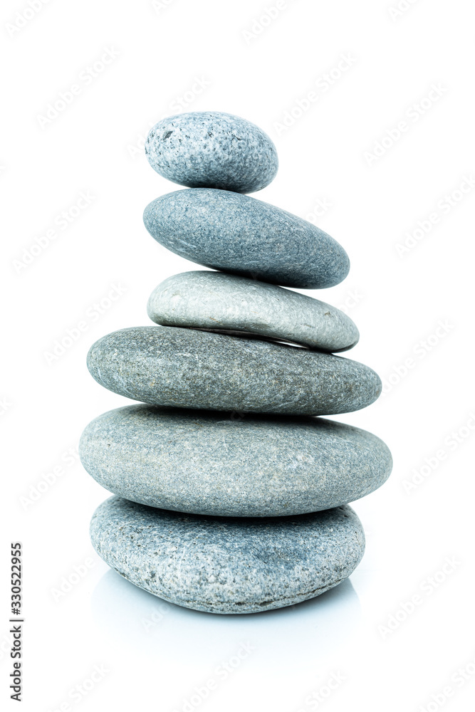 Stacked harmony stones in zen balance. pile of stones isolated on white background Stacked harmony stones in zen balance. pile of stones isolated on white background