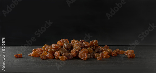 Heap of Dark Brown Sweet Raisins, Dried Grapes Pile