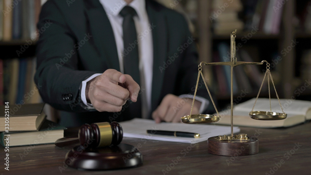 Close up Shoot of Judge Hand pointing Finger in Court Room Table Close up Shoot of Judge Hand pointing Finger in Court Room Table