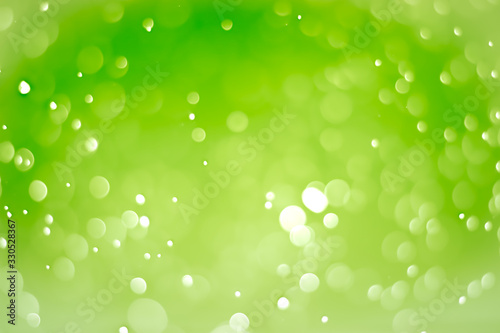 Abstract bokeh lights with light green background