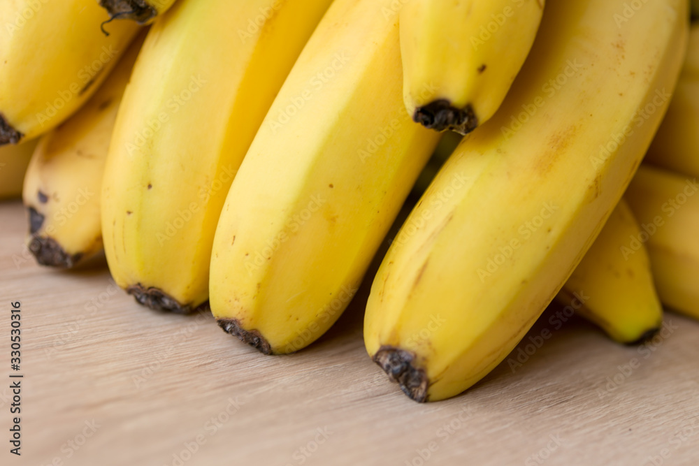 Bunch of ripe bananas background. Selected focus.