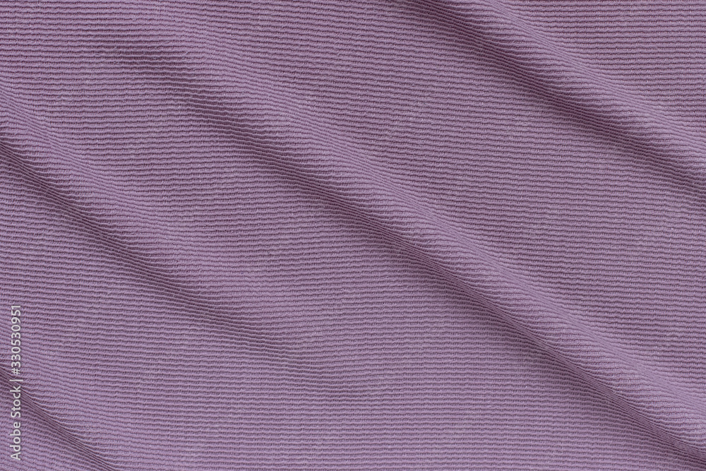 lilac ribbed corduroy texture background with soft folds on the surface. lilac ribbed corduroy texture background with soft folds on the surface.