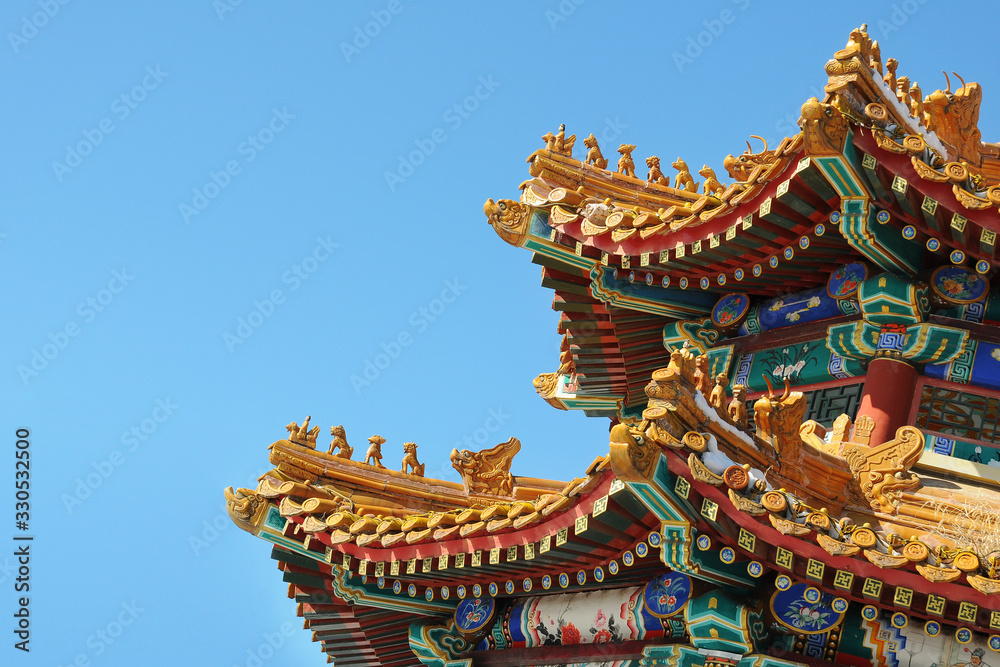 Beautiful Chinese temple roof with colorful architectural works.