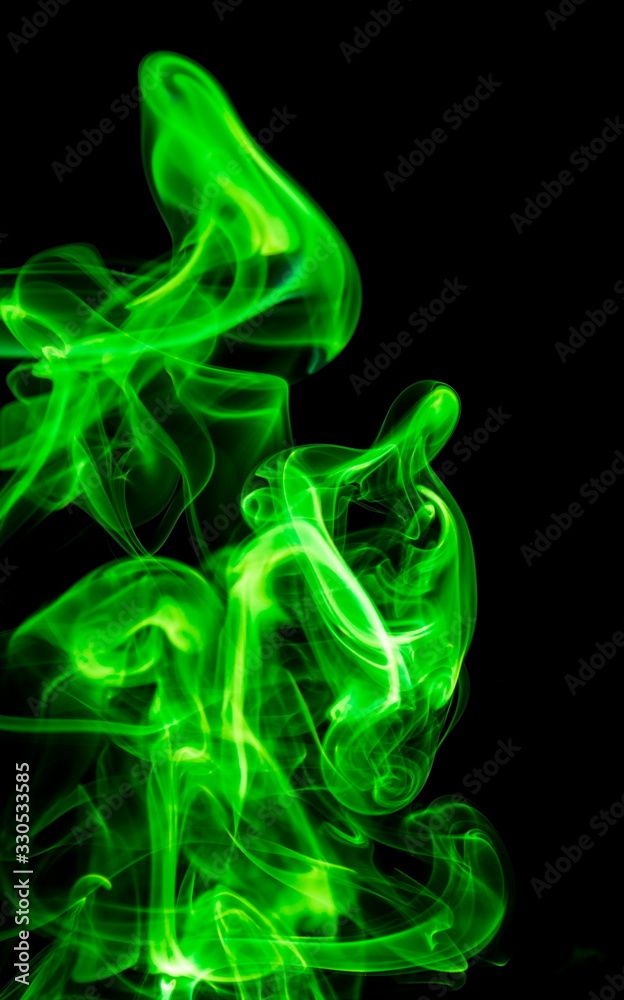 Green smoke on black background Green smoke on black background