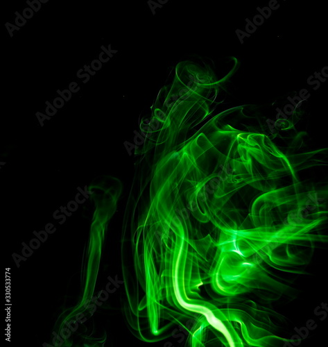 Green smoke on black background