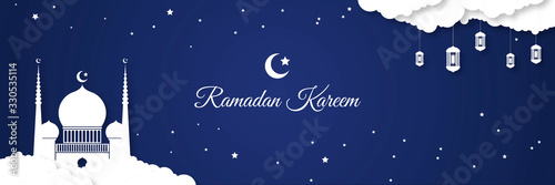  White blueish luxury geometrical ramadan ornament decoration with hanging white fanoos arabian lantern with blue night background and calligraphy for ramadan kareem.  Ramadan kareem background. 