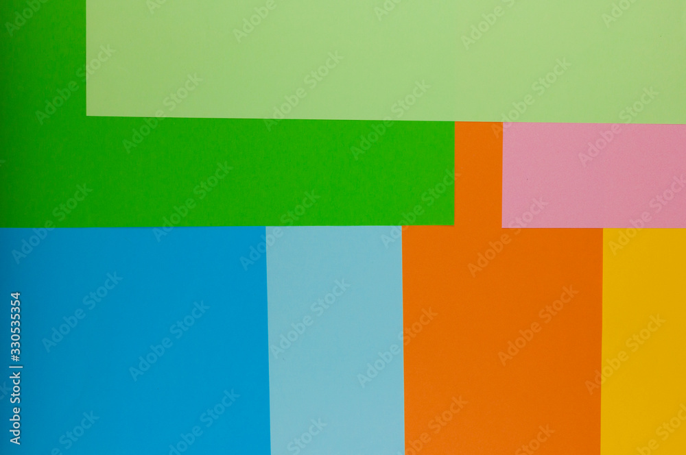 Color papers geometry flat composition background with rainbow tones