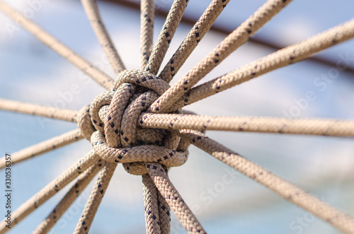 many ropes and one big knot close up photo