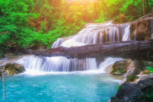 Fototapeta Naklejka Na Ścianę i Meble -  The beautiful Erawan cascade waterfall with turquoise water like heaven and sunlight at the tropical forest ,Kanchanaburi National Park, Thailand