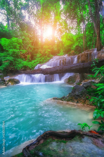 The beautiful Erawan cascade waterfall with turquoise water like heaven and sunlight at the tropical forest  Kanchanaburi National Park  Thailand