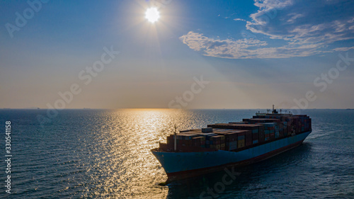 Logistics and transportation of International Container Cargo ship and sunset © Photo Gallery