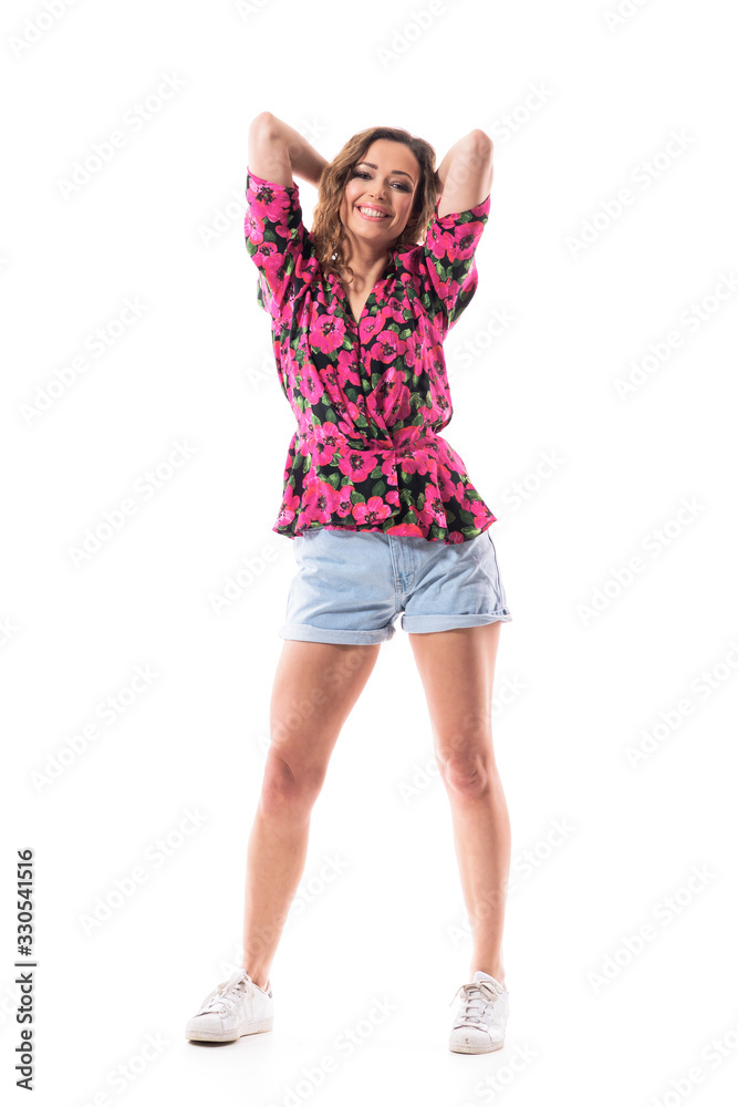 Fototapeta premium Happy summer style clothes young curly hair woman smiling and looking at camera. Full body length isolated on white background.