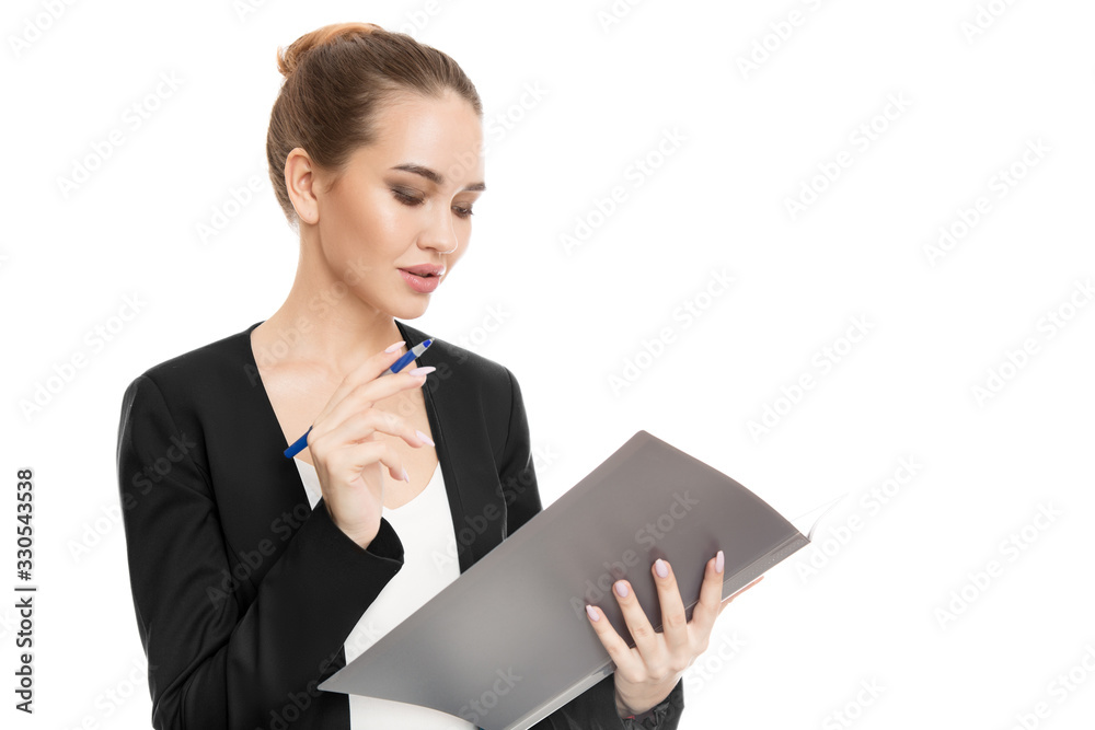 beautiful business woman in suit on a white background. write in the folder. manager beautiful business woman in suit on a white background. write in the folder. manager