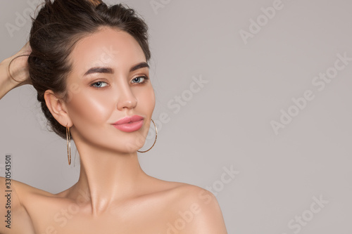 Fashion woman portrait. Young beautiful with perfect skin and make-up.