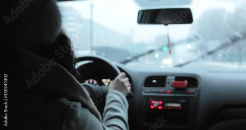 Woman Drives Car On The Dangerous Winter Road With Potholes