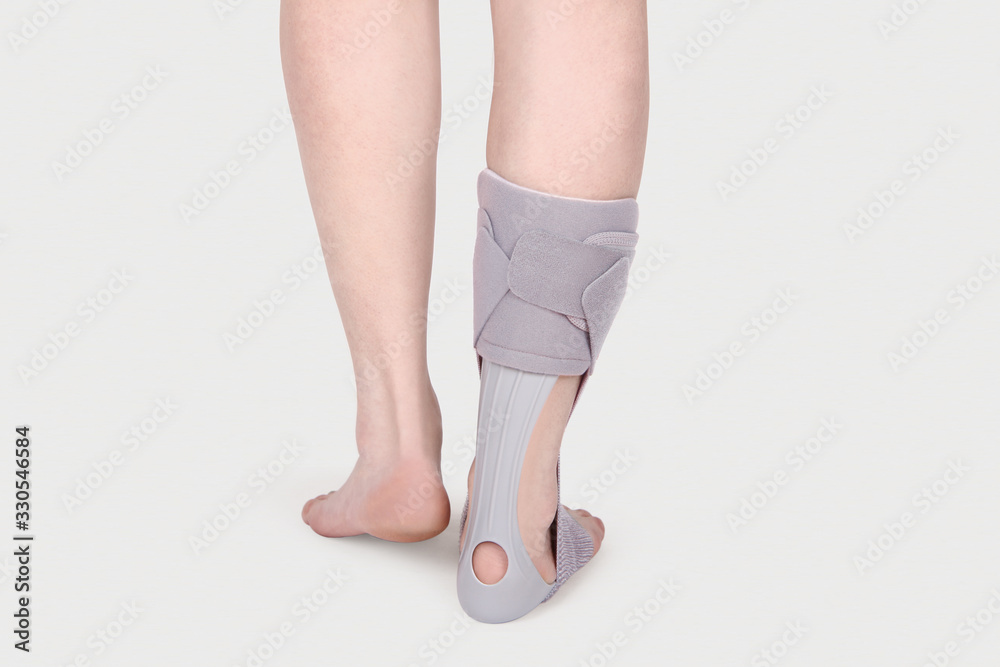 Orthopedic Ankle Brace. Medical Ankle Bandage. Medical Ankle Support Strap Adjustable Wrap Bandage Brace foot Pain Relief Sport. Leg Brace isolated on white background Orthopedic Ankle Brace. Medical Ankle Bandage. Medical Ankle Support Strap Adjustable Wrap Bandage Brace foot Pain Relief Sport. Leg Brace isolated on white background