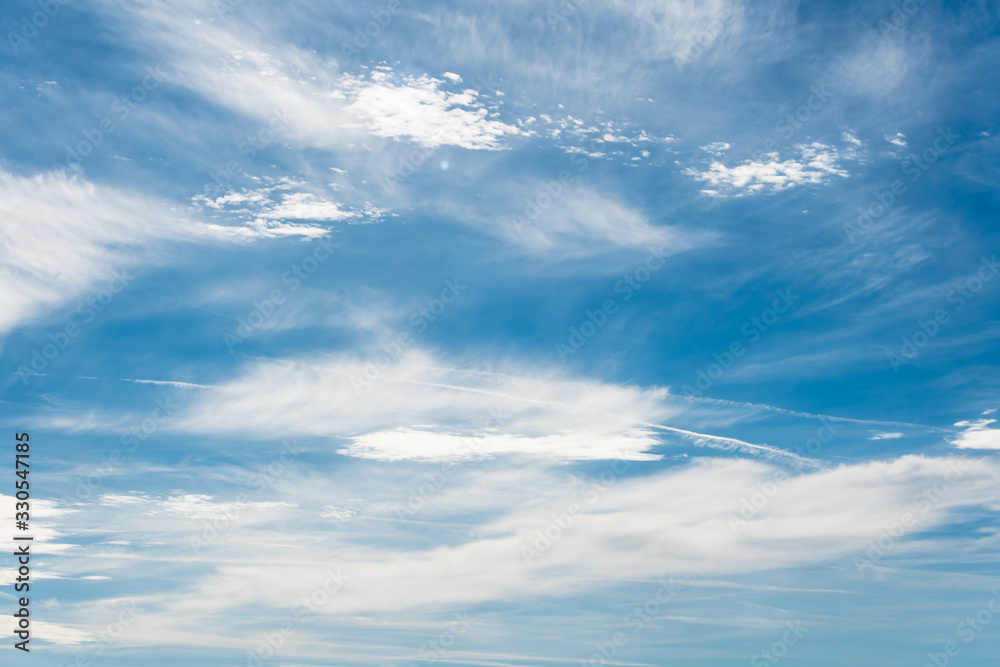 White clouds in a bright blue sky. The beauty of the nature